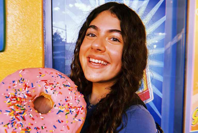 Ashley Befumo is holding a Doughnut